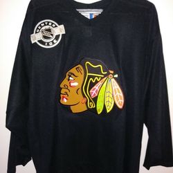 CCM licensed Chicago Blackhawks Jersey Mens size Large and black in color with Blackhawk emblem on front. Very lightly used (worn a couple times). EXC