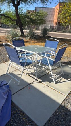 Outdoor table, 4 chairs and umbrella