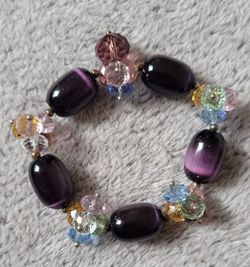 Beaded Stretch Bracelet With Purple Glass " Cat's Eyes " Beads And Multicolored Crystal-like Beads.
