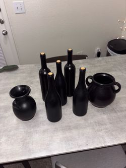Decorative wine bottles and vases.