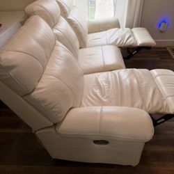 Reclining white couch with port