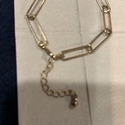 Gold tone chain bracelet.