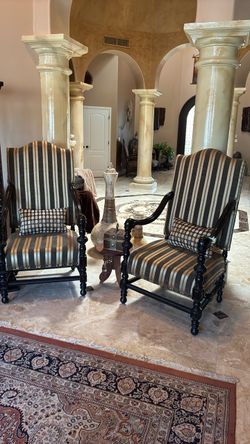Hand carved captain chairs