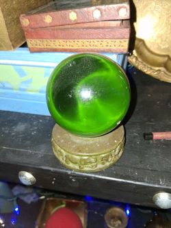 Crystal ball with elephants around the base