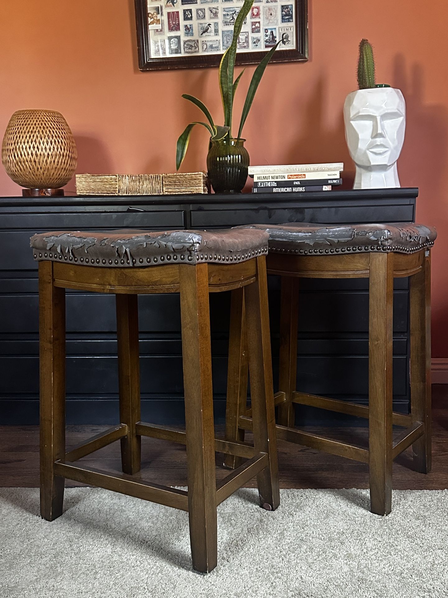 2 faux leather Saddle Bar stools
