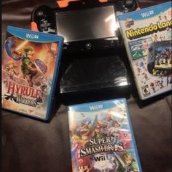 NINTENDO WII U + GAMES AND CABLES