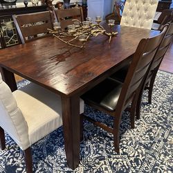 Heavy wood table with four side chairs, and two upholstered endchairs