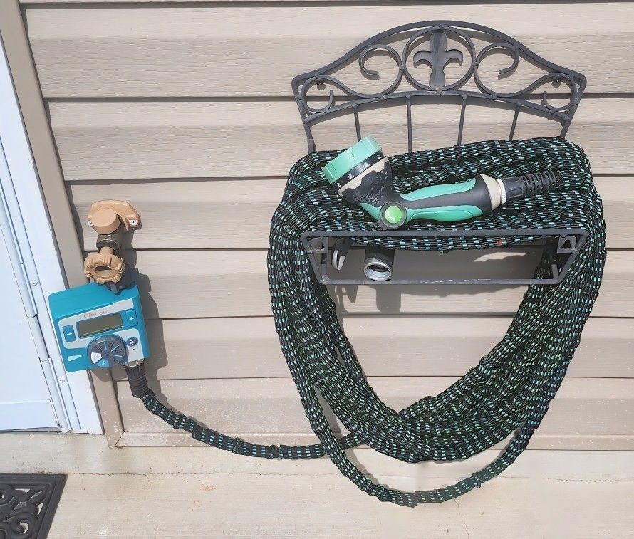 2 water hoses w/faucet timers