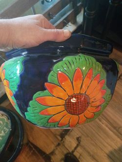 Assorted Mexican hand painted terra cotta pots in various shapes and sizes