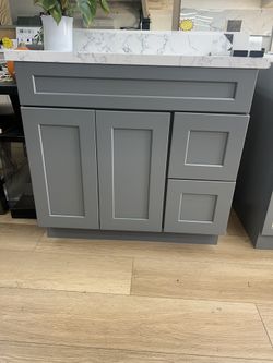 36-inch vanity with adjustable drawer and sink position (left or right). Solid wood cabinet with countertop — special price.