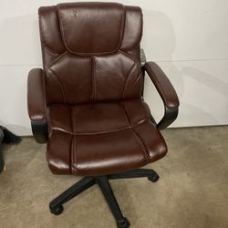 Brown leather desk chair with armrest