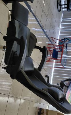 Gaming chair with vibrating massage back pillow