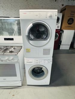 Bosch 24-inch wide electric washer and dryer; includes a receipt for a 60-day warranty.