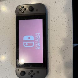 Nintendo Switch + Carrying Case + Super Mario Deluxe