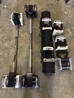PowerBlock dumbbells 125 lbs plus attachments
