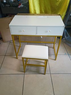 2 Drawers Makeup table with chair. Table L31in. D15.5in. H 29in. Chair L 15. D11. H 16.5. Metal frame. ---AS IS
