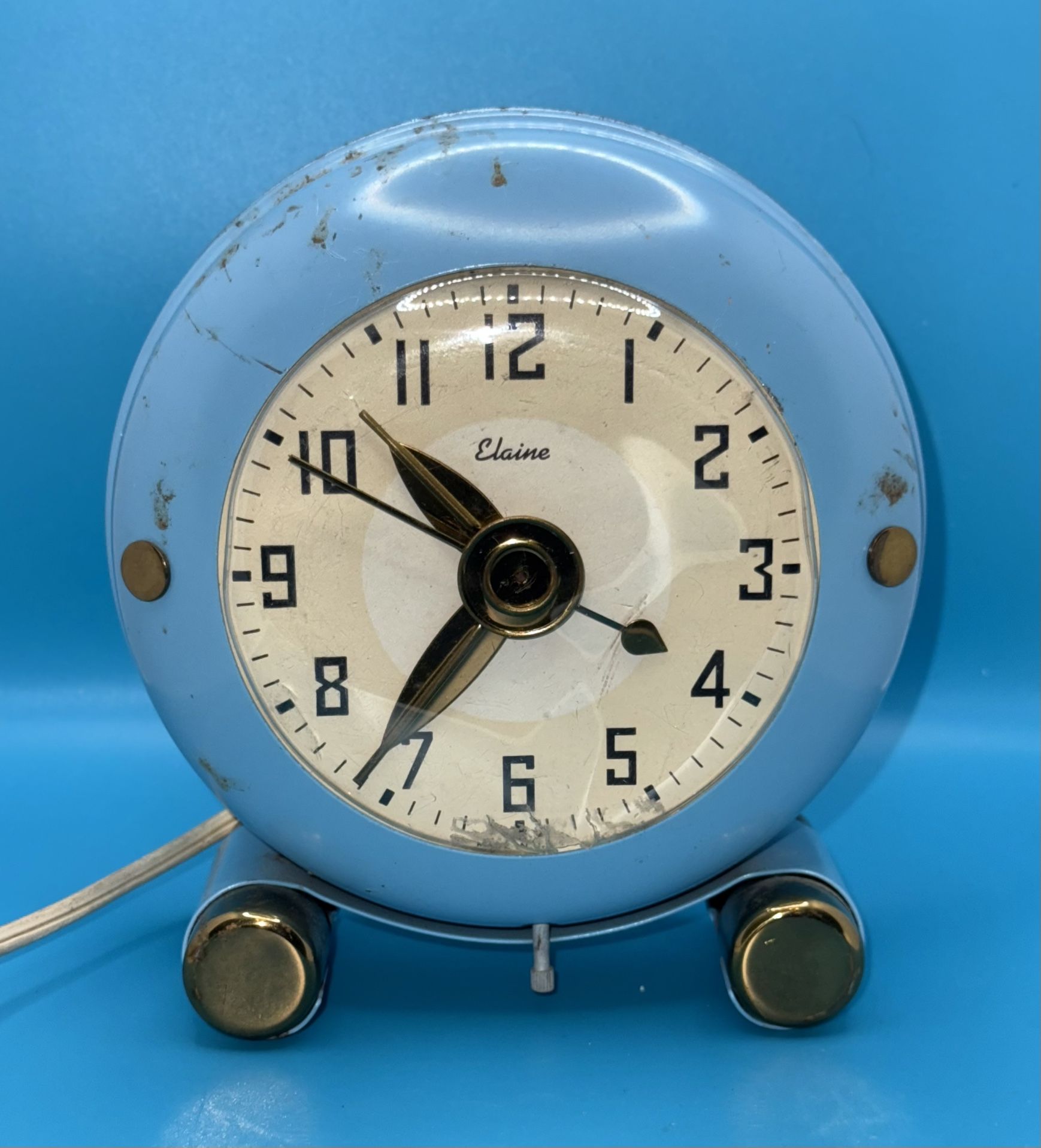 Elaine electric alarm clock. These clocks were popular in the mid-20th century and are now considered collectibles.