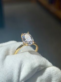 Brand new Gold Tone 3CT Oval Cut CZ Engagement Ring in 7