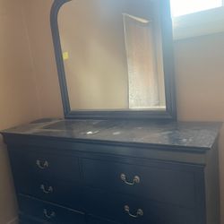 Dresser with mirror attached