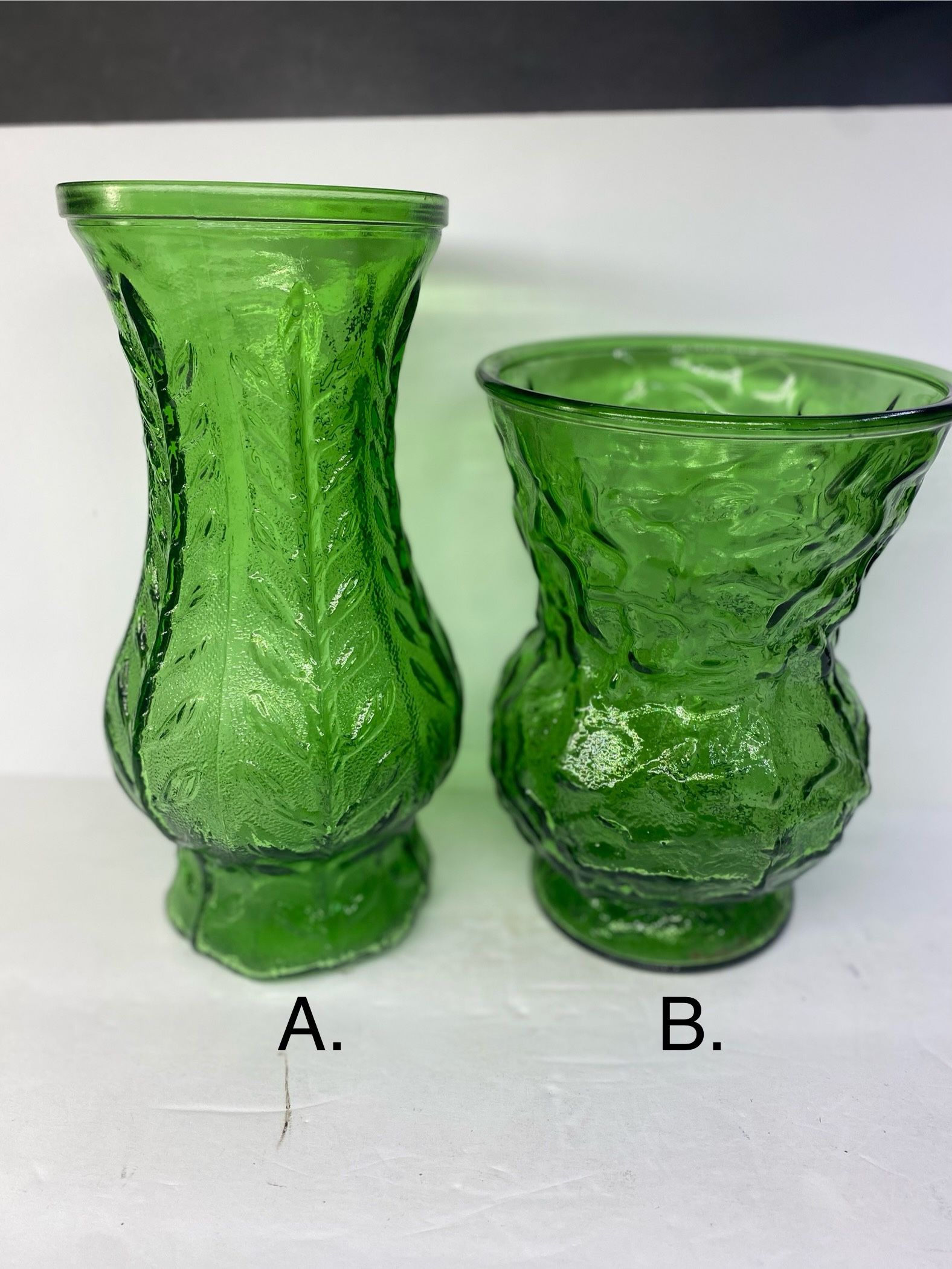 $19. Each or both for $29. (A) Vintage 1978 FTD Emerald Green Glass Flower Vase 10” Decorative Leaf Design. (B) Vintage EO BRODY 8” Flare Top Round B