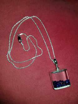 Brand new just blue sapphires in a shaker floater locket $125