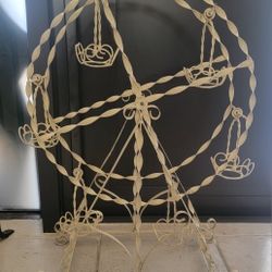 Vintage wrought metal carousel plant holder