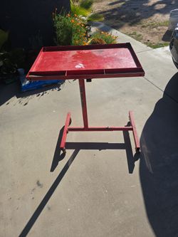 Adjustable rolling Work table.