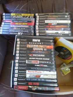 PlayStation 2 System w/ games & racing wheel