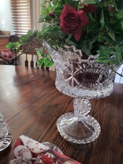 Crystal set large, 2 candle holders and one with the flowers in the center. All perfect, very old, heavy crystal. The three p sets are two hundred dol