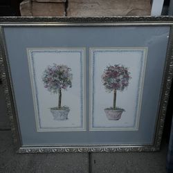 set of two ornate framed botanical artworks featuring topiary trees, by artist Carolyn Bucha.