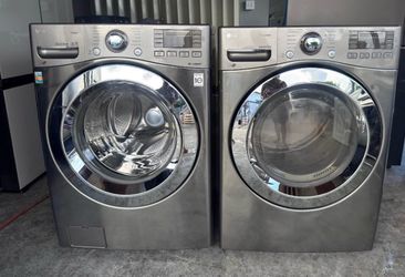 STAINLESS LG WASHER AND DRYER IN MINT CONDITION.