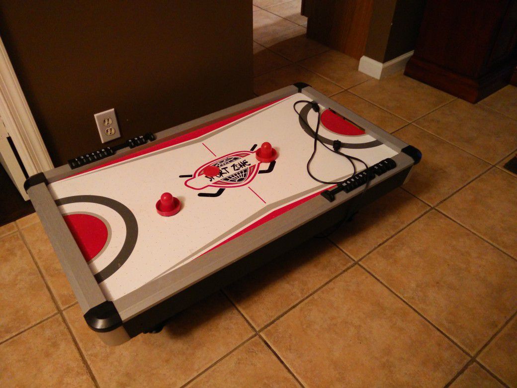 Small child's electric air hockey table