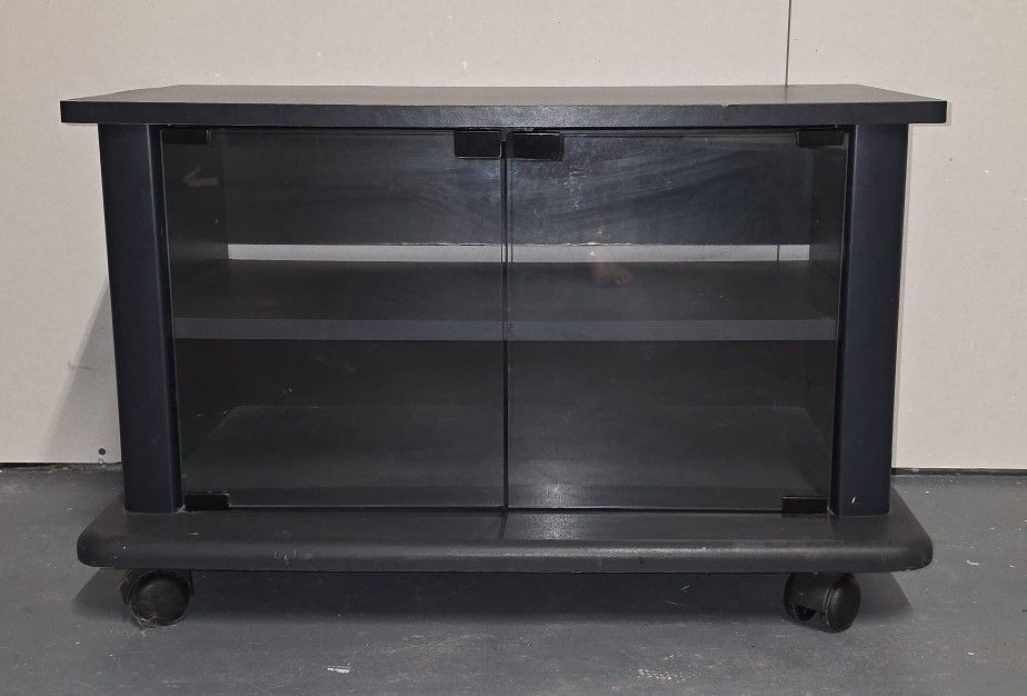Black Rolling TV Stand / Media Console with Shelves and Glass Doors  