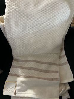 Two brand new beige off white spa bath towels