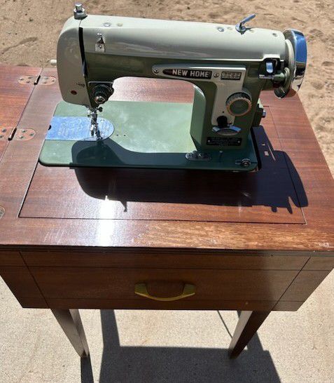 Sewing Cabinet Table Fliptop Hiding Spot Solid Wood with working Janome New Home Streamliner Sewing Machine Good condition 