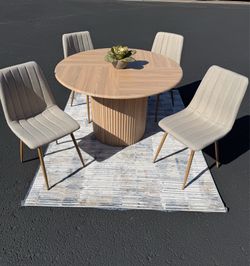 Barrel dining table and 4 gray chairs