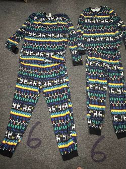 Matching Christmas pajamas in a men’s 2XL and woman’s Medium