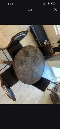 Round marble table with chairs