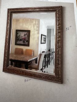 Ornate silver wall mirror