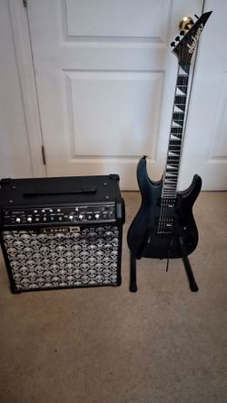 Jackson flat black 2019 with standard tremolo & Line 6 30 watt amp  12 " Celestion