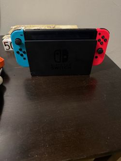 Nintendo Switch with Neon Joy-Cons in Dock