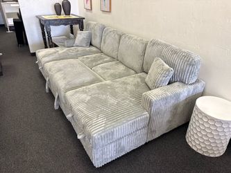 Grey corduroy double chaise sectional with pull out sleeper