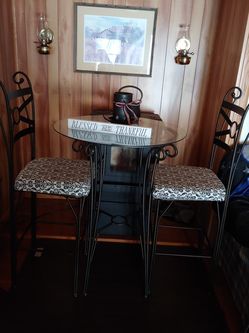Wrought Iron glass top table and 2 chairs