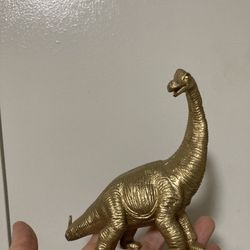 Gold Sinclair dinosaur 