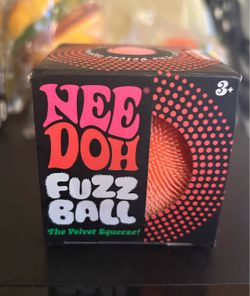 New orange needoh fuzz ball