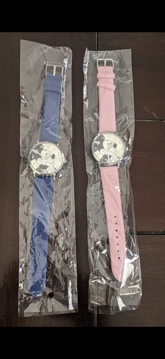 One pink, one blue Mickey mouse watch, not kid sizes great for teens or women