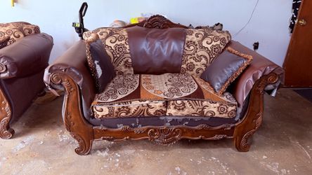 Selling a matching 2-piece traditional sofa set with carved solid wood frames.