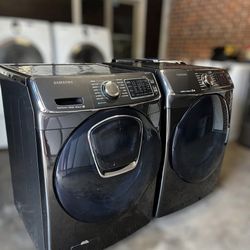 Samsung washer and electric dryer set. 