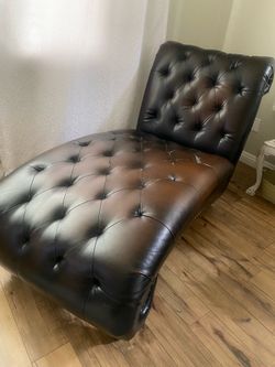 Brown leather chaise lounge