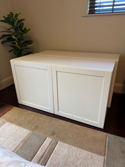Two White IKEA Bestå Shelved Storage Consoles